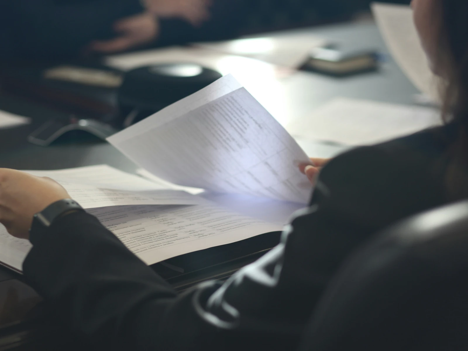 Close-up of a lawyer reviewing a printed document